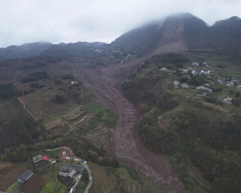Rescuers recover 1 body and search for 28 people in a landslide in southwest China