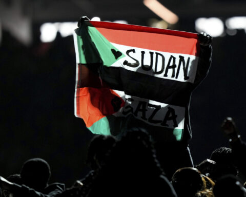 Member of Kendrick Lamar's Super Bowl halftime show won't face charges for flag protest