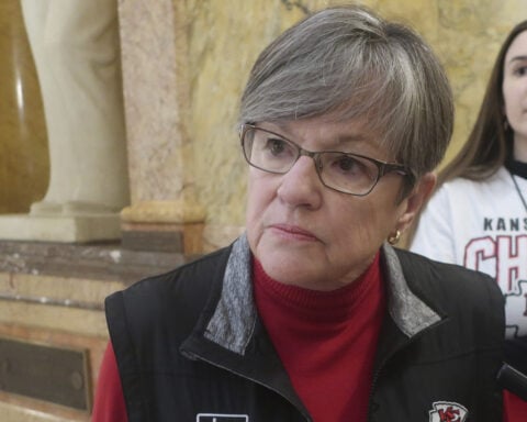 Kansas' Democratic governor vetoes a GOP-backed ban on gender-affirming care for trans minors