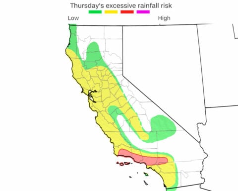 Heavy rain and risk of ‘life-threatening’ debris flows prompt evacuation warnings in LA fire areas as snow hits the Midwest