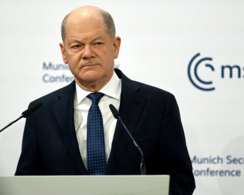 Scholz says Germans will decide their democracy for themselves, hitting back at Vance