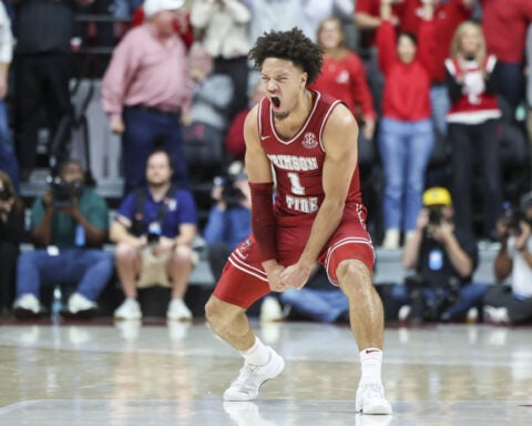 No. 1 Auburn edges No. 2 Alabama in a showdown of top-ranked teams; a rematch is set for March 8