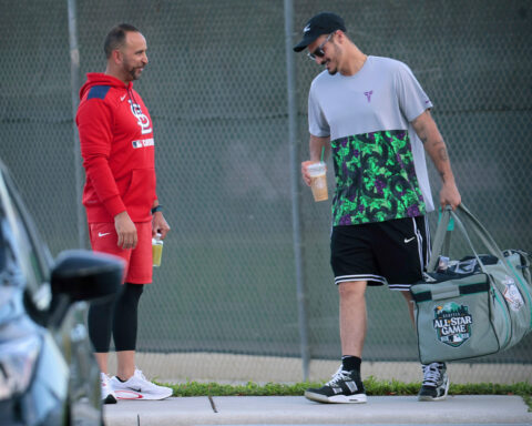 Nolan Arenado reports to camp after the Cardinals tried to trade him in the offseason
