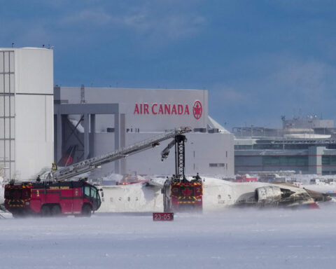 Delta plane flips on landing at Toronto airport, injuring 8