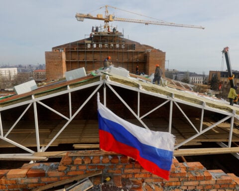 Villagers in Russian-controlled Ukraine visit homes destroyed in long conflict
