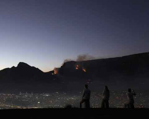 More than 100 firefighters battle blazes on South Africa's Table Mountain in Cape Town