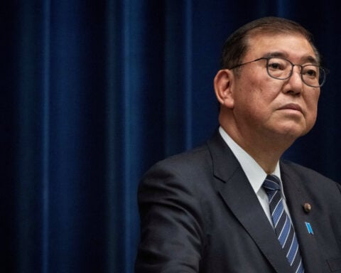 Japan PM's coalition trims draft budget despite spending pressure