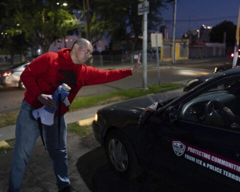 Volunteers use bullhorns and sirens to warn immigrants when ICE is in their area