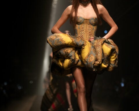 Versace struts confident collection as rumors swirl that the Milan fashion mainstay is on the market