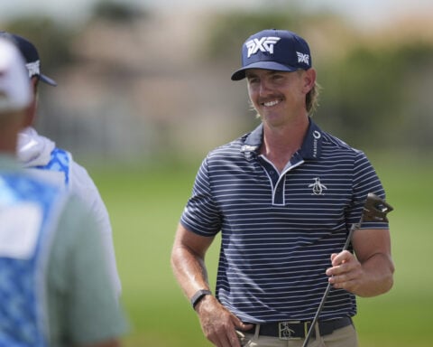 Jake Knapp hangs on to the lead with more than a dozen players in the mix at Cognizant Classic