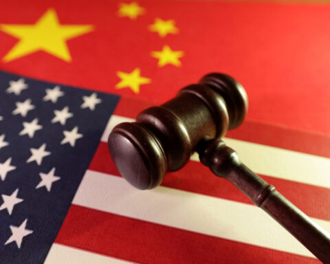 China imposes new curbs on U.S. firms as trade row grows