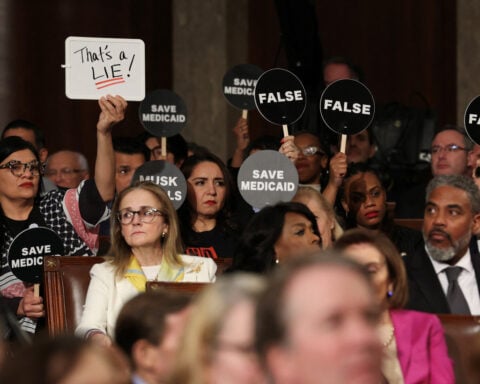 Democrats protest Trump's speech to Congress with disruption, exits and solemn signs