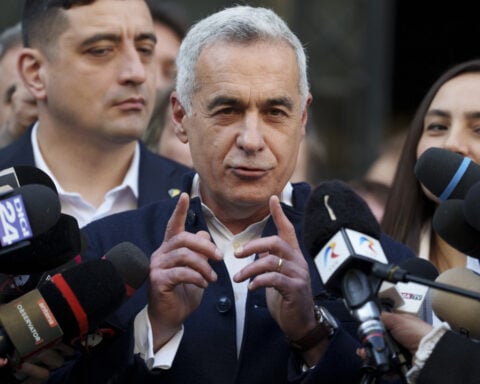 Far-right front-runner in Romania’s annulled presidential race files his candidacy in the rerun