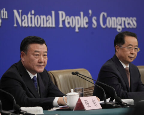 Consumer prices fell in China in February and remain flat in a sluggish economy
