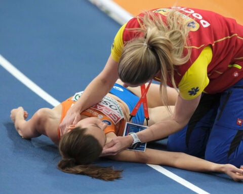 Dutch runner Maureen Koster hospitalized after hitting head on track and falling unconscious during race