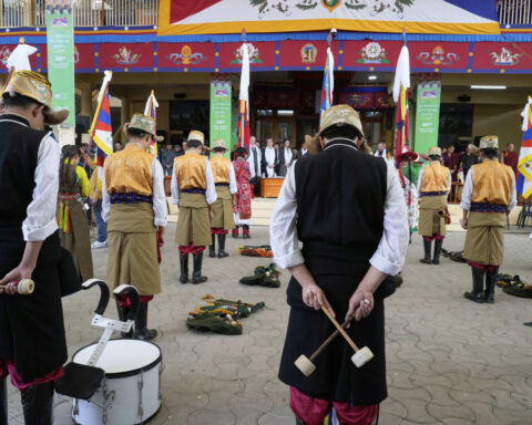Tibetans scuffle with police outside the Chinese Embassy in India as they mark uprising anniversary
