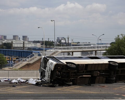 12 dead, dozens hurt as a bus overturns and passengers are thrown on a highway in South Africa