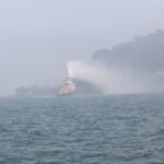 Fires burn after ships collide off UK, stoking fears over environment