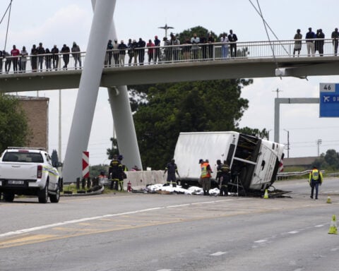 16 are dead and dozens are hurt after a bus flips on a highway in South Africa