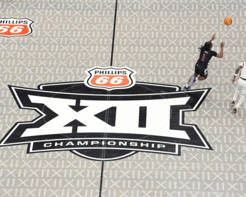 Crass or cool, awesome or eyesore: Big 12 Tournament's logo'd court makes a statement either way