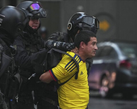 Argentine retirees and soccer fans clash with police during protests against austerity measures