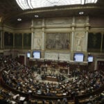 French lawmaker who uses a wheelchair wins a change in voting rules that discriminated against him