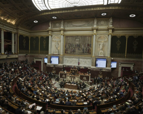 French lawmaker who uses a wheelchair wins a change in voting rules that discriminated against him