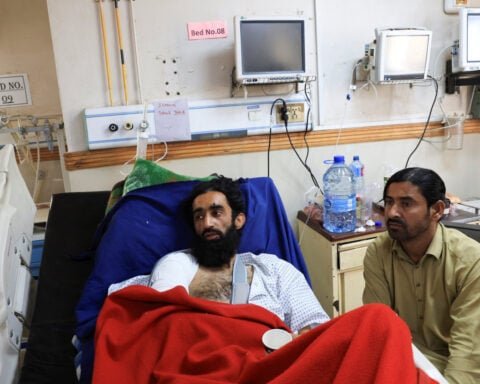 Pakistan train attack survivors 'crouched for hours' to survive