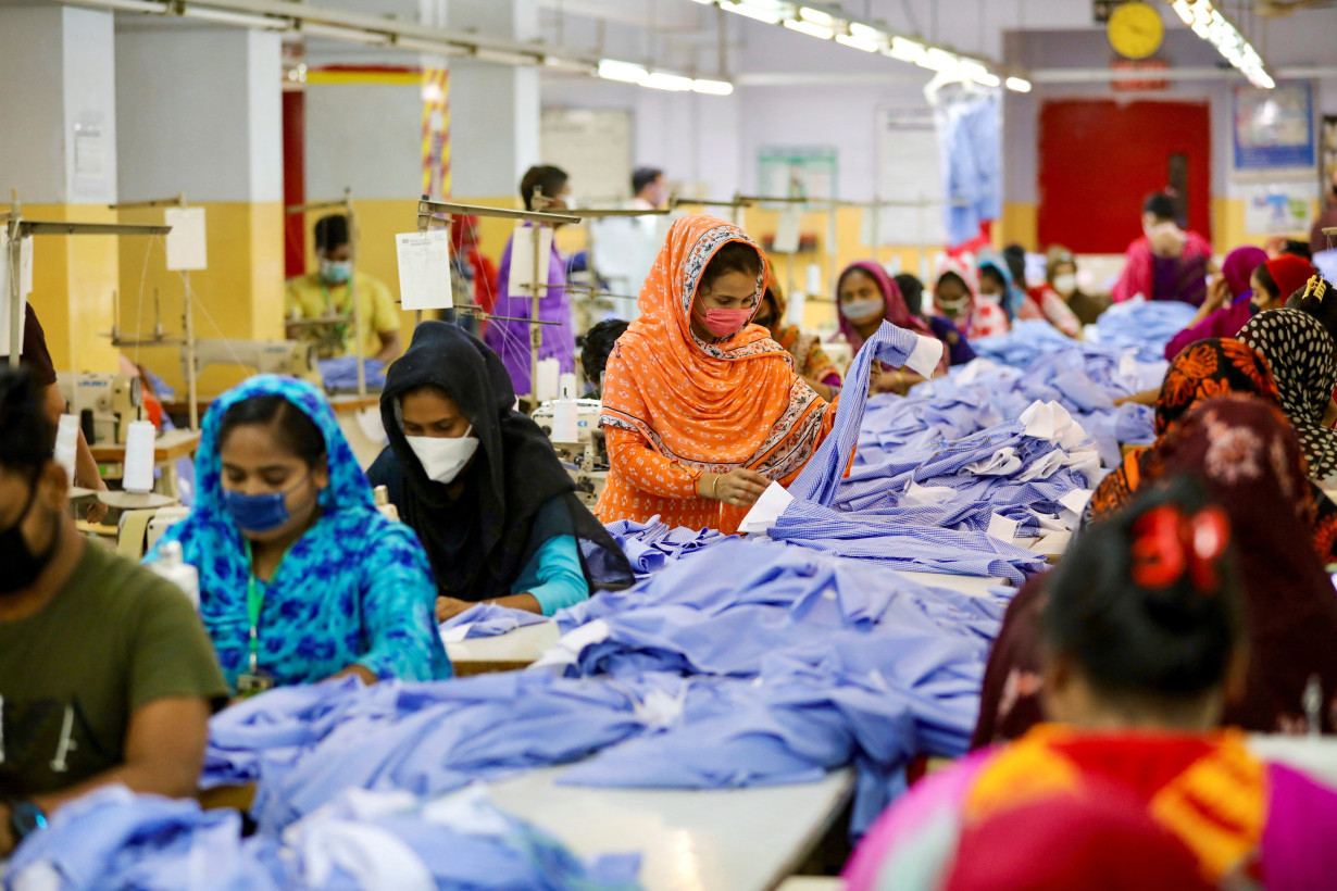 FILE PHOTO: Women work in a garment factory in Dhaka, Bangladesh