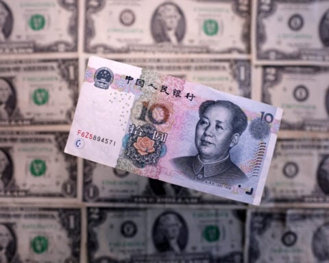 China's central bank asks state lenders to reduce dollar purchases, sources say