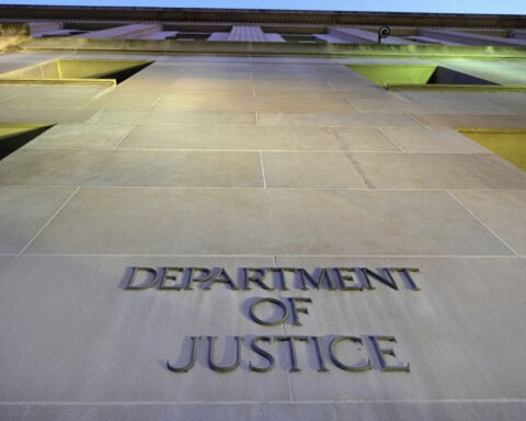 Justice Department sharply criticizes judge who blocked enforcement of an order targeting a law firm