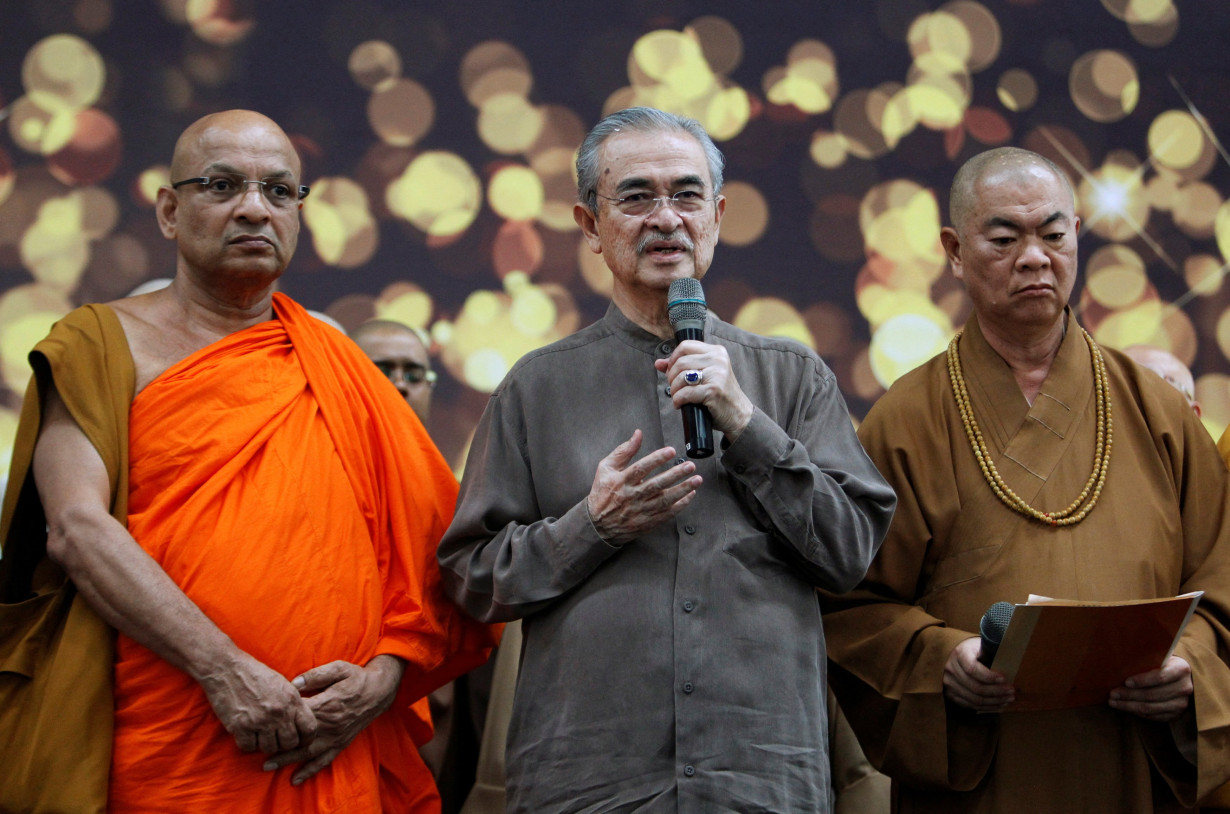 FILE PHOTO: Malaysia's former prime minister Abdullah Ahmad Badawi takes part in multi-religion mass prayers for the passengers of Malaysian Airlines flight MH370 at Kuala Lumpur International Airport in Sepang