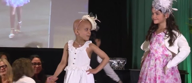 Six-year-old fighting cancer shines at fashion show