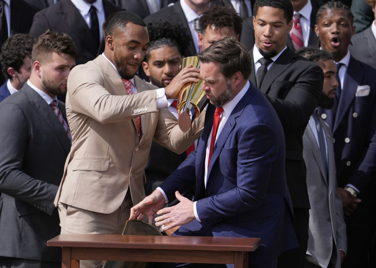 Vance fumbles Ohio State's NCAA football championship trophy as Buckeyes visit the White House