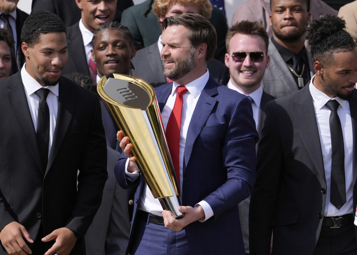 Vance fumbles Ohio State's NCAA football championship trophy as Buckeyes visit the White House