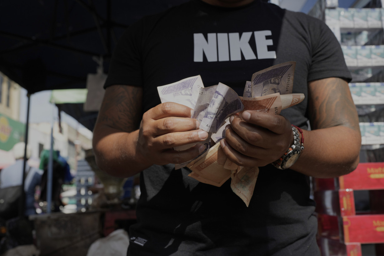 Inflation, currency woes worsen Venezuela's complex crisis as Maduro declares 'economic emergency'