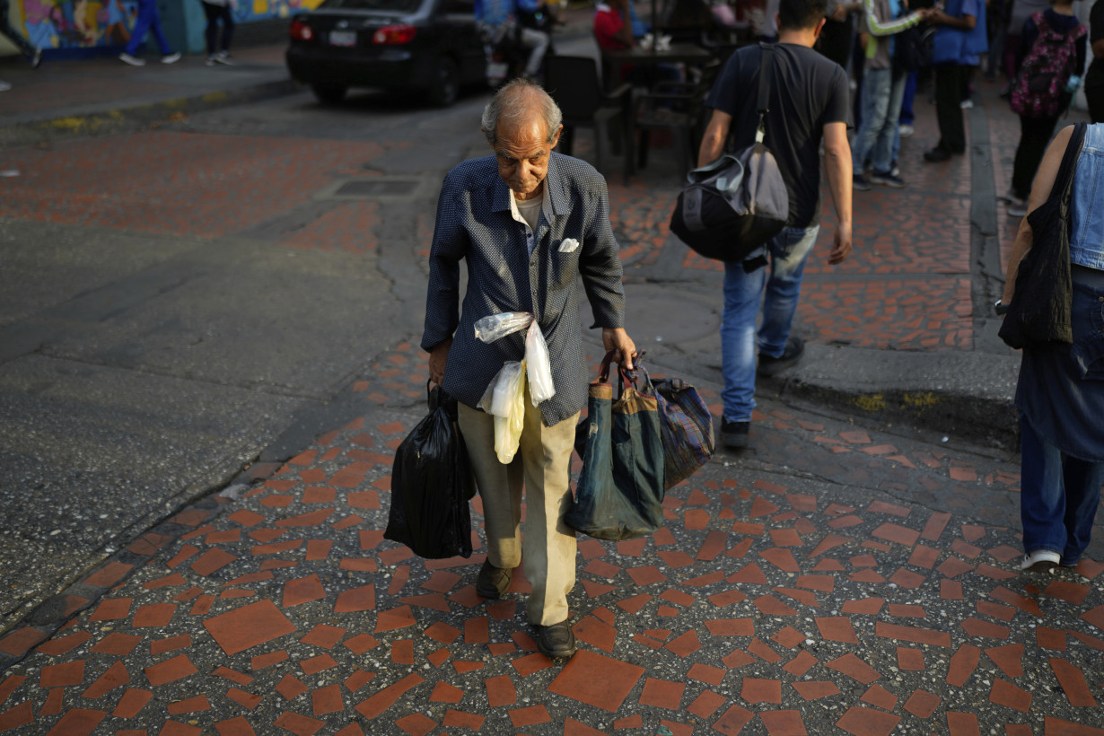 Inflation, currency woes worsen Venezuela's complex crisis as Maduro declares 'economic emergency'