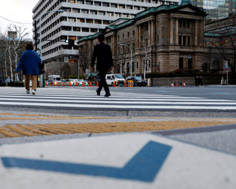 Yen slides with JGB yields after BOJ cuts growth forecasts