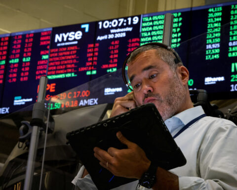 US stocks end higher on tech boost, yen slides on BOJ gloom