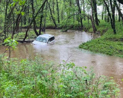 Minivan floating down creek, driver yelling for help!