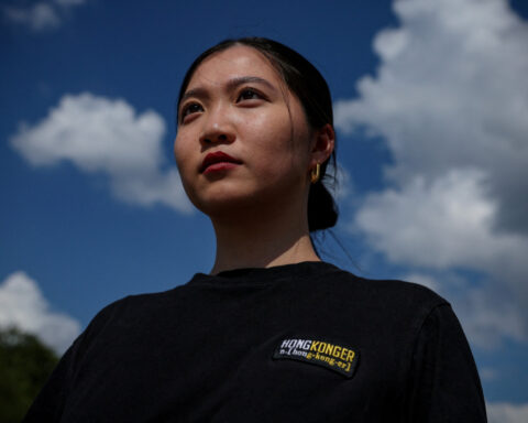 Hong Kong police arrest father and brother of wanted activist Anna Kwok