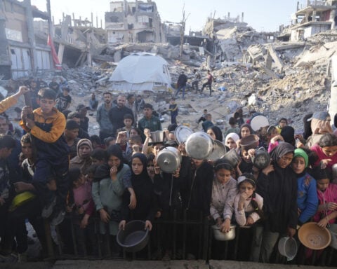 Desperate children and adults in Gaza struggle to get food as Israel blocks aid