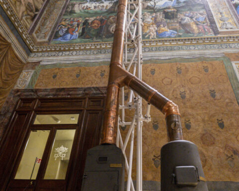 Vatican workers install Sistine Chapel stove where ballots are burned during conclave to elect pope