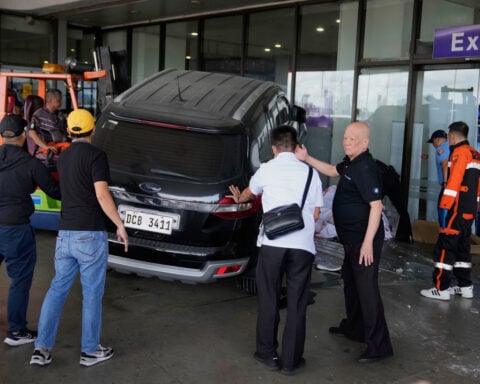 Four-year-old girl and man dead after driver crashes SUV into Manila airport, Red Cross says