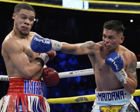 Inoue overcomes early knockdown, dominates Cardenas to remain undefeated with 8th-round TKO