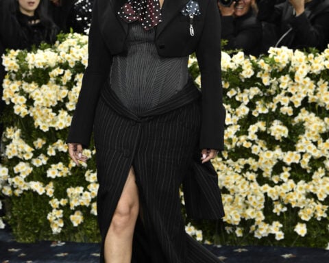 The Latest: The Met Gala opens as rain fails to dim the stars for fashion's biggest night