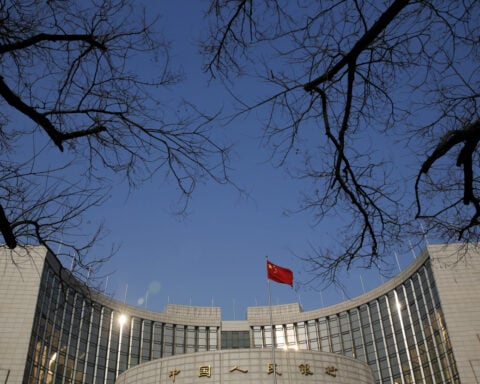 China central bank governor says will cut banks' reserve requirement ratio