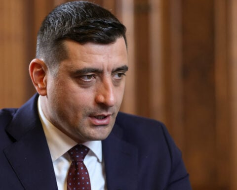 Romania curbs debt sale plan as presidential favourite rules out tax hikes