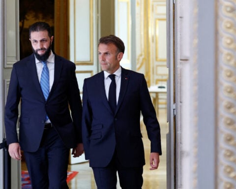 France's Macron: will pursue progressive lifting of EU sanctions on Syria