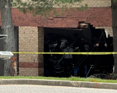 Man dies after crashing into office building, causing partial collapse, police say